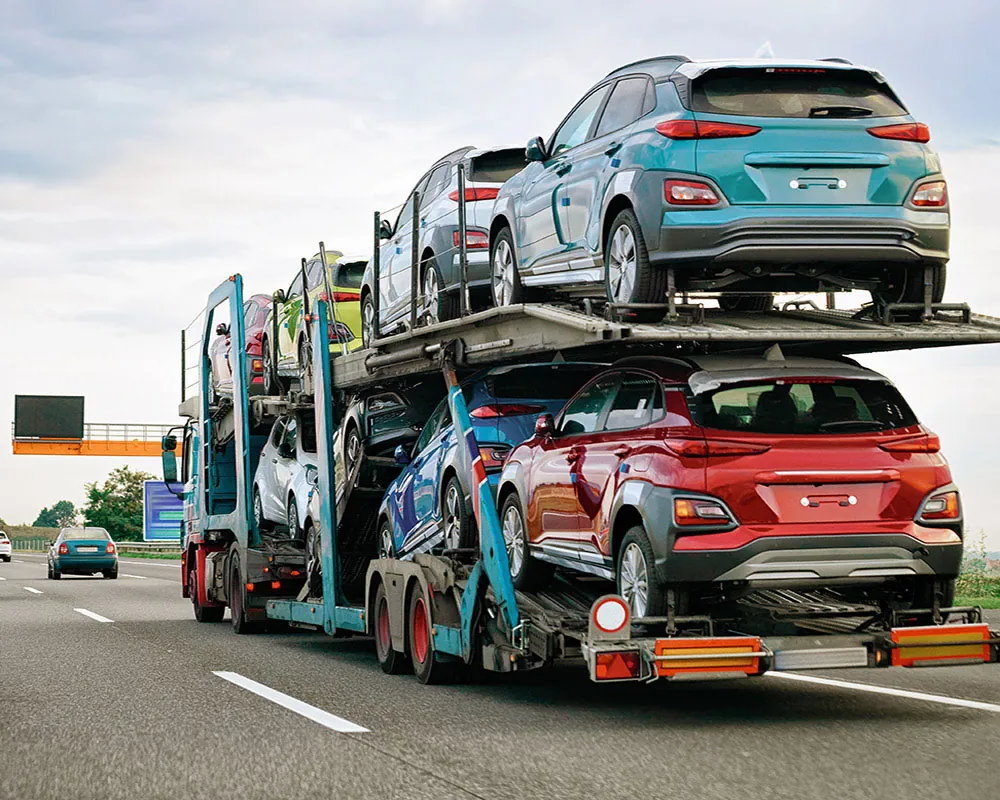Modern auto transport technology - carrier truck on highway